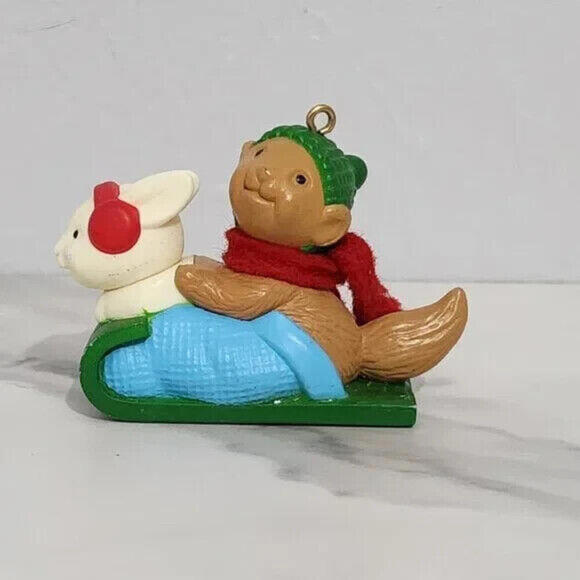 3/$25 1984 Avon Bunny & Squirrel Sledding Christmas Ornament - Picture 1 of 7